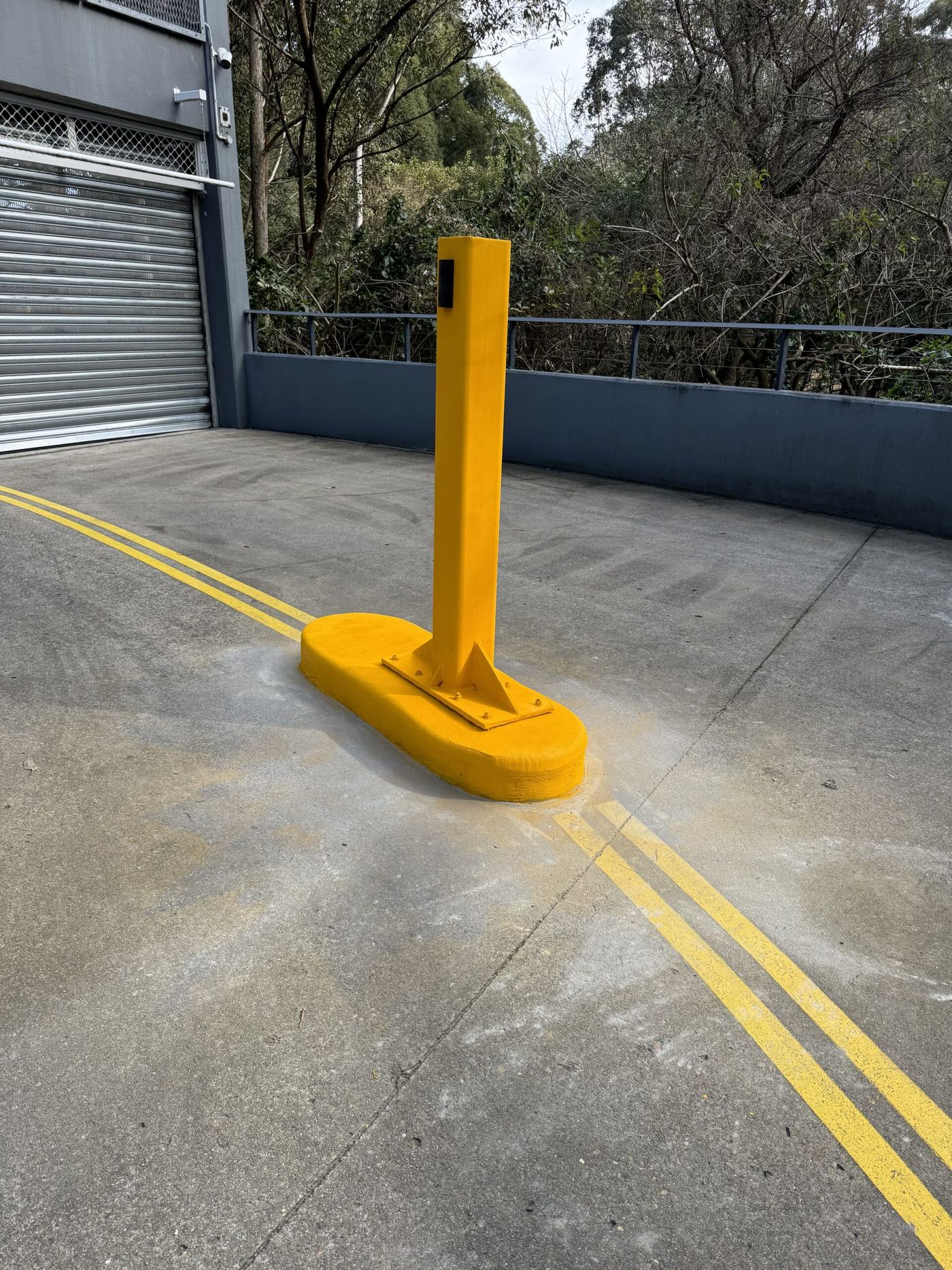 Concrete bollard restoration project for JLL